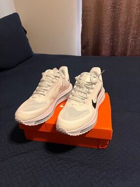 Nike White Sneakers with Black Swoosh Accent